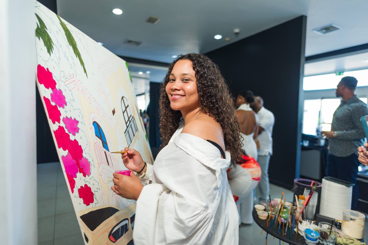 Kathryn Samuda, One Great Studio web project manager, adds her own touch to the evening through the live art installation by Simone Raquel Art.