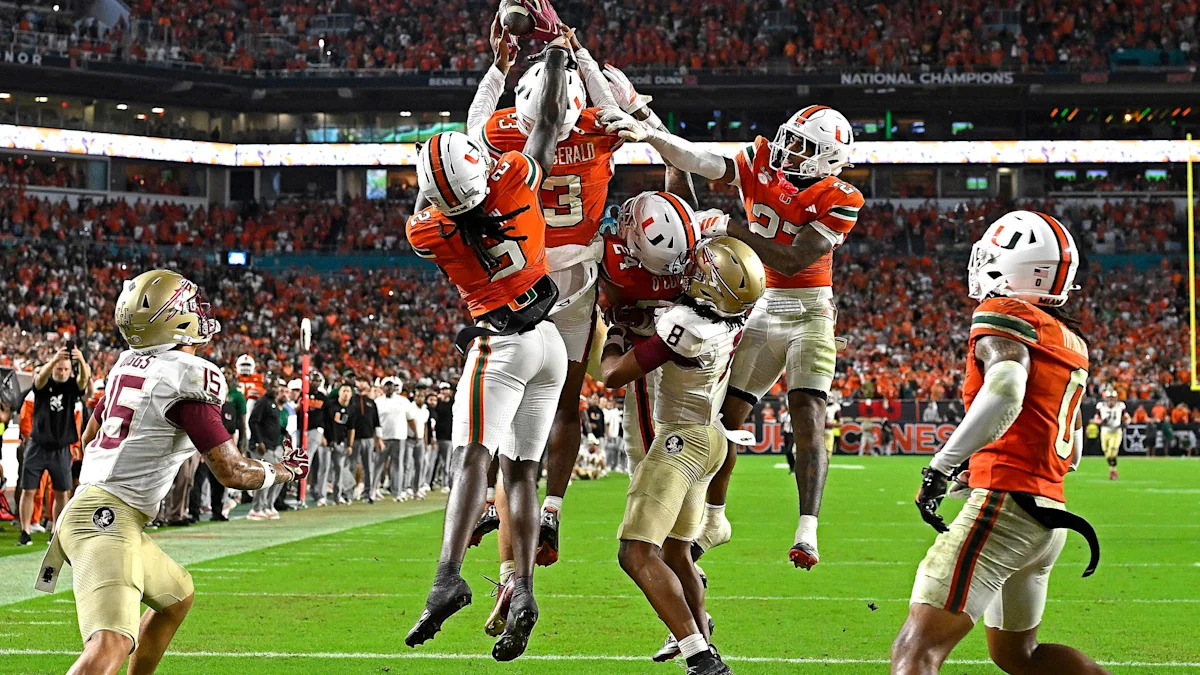 MIAMI GARDENS - OCTOBER 17: Miami defensive back Bryce Fitzgerald (3) intercepts an FSU pass to the end zone in overtime to end the game (also pictured, defensive back Dylan Day (23), defensive back Damari Brown (2), defensive back Omar Thornton (0); Florida State wide receiver Micahi Danzy (8), wide receiver Jayvan Boggs (15)) the Miami Hurricanes faced the Florida State Seminoles on October 17, 2026, at Hard Rock Stadium in Miami Gardens, FL. (Photo by Samuel Lewis/Icon Sportswire via Getty Im