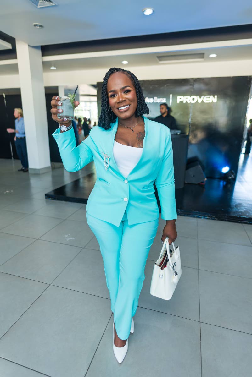 Deidre-Ann Beason, owner of Danisha Meat Mart and Grocery, makes a statement in a blue power suit from Trick & Trend.